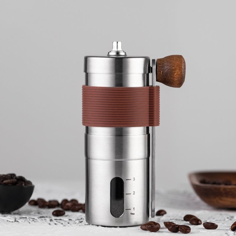 Manual coffee grinder with adjustable settings and foldable handle