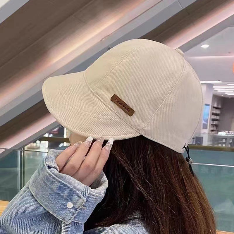 Women's sun hat with wide brim and adjustable fit