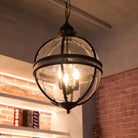Hanging chandelier light with globe shades