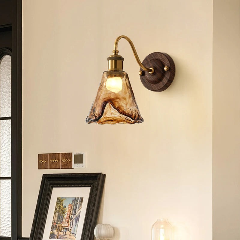 Wall sconce light with scalloped glass shade
