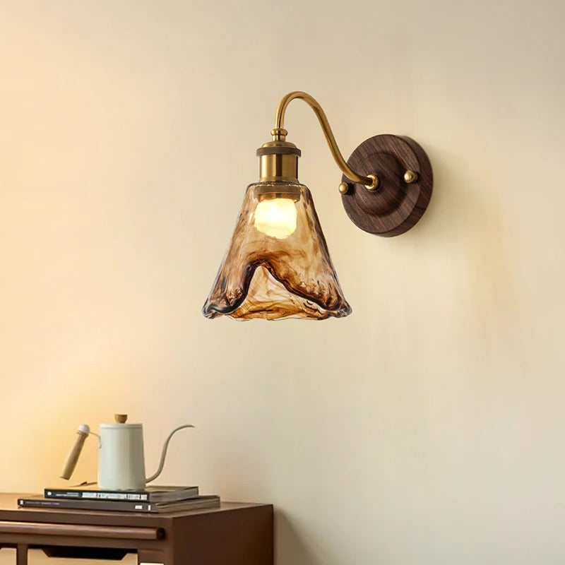 Wall sconce light with scalloped glass shade