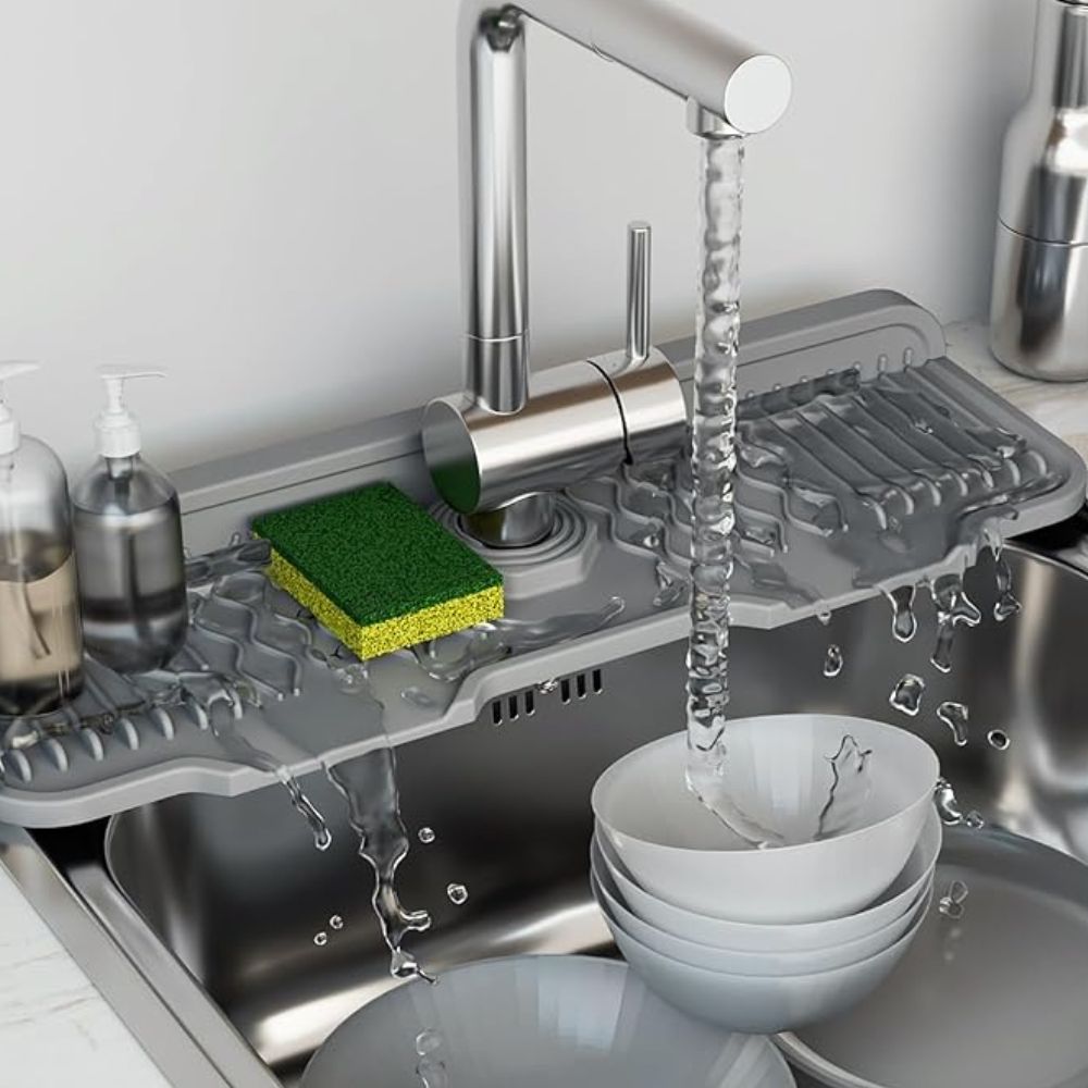 Silicone sink mat with drainage channels around faucet