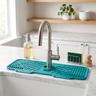 Silicone sink mat with drainage channels around faucet - ocean green
