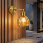 Wall Sconce with Tulip Shaped Glass Shade and Metal Mount - amber