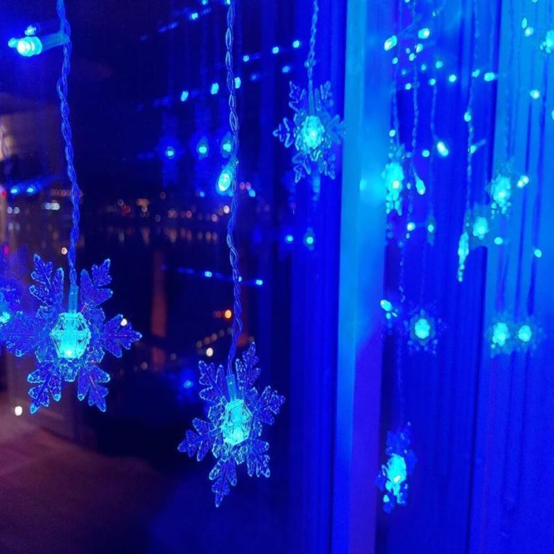 LED curtain lights with snowflake design for festive decor - blue