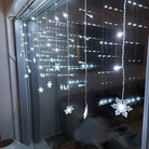 LED curtain lights with snowflake design for festive decor - white