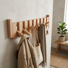 Wall mounted coat rack with hooks and solid wood