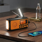 Emergency radio with hand crank and LED flashlight