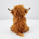 Highland cow plush toy with realistic fur detail