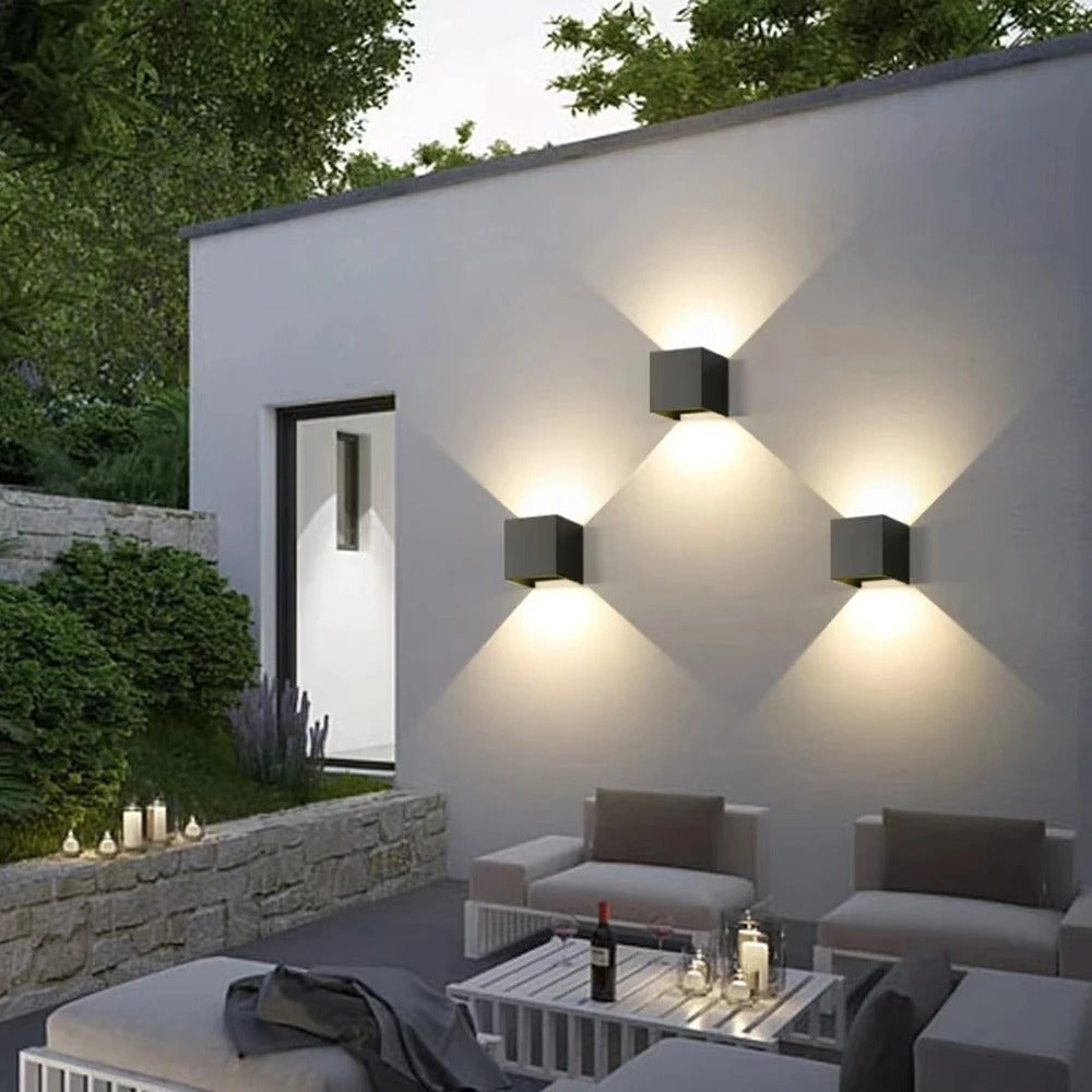 Outdoor wall light with slim vertical housing