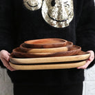 Wooden serving tray with irregular decorative shape