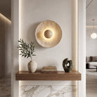 Wall sconce light with textured stone finish - wood
