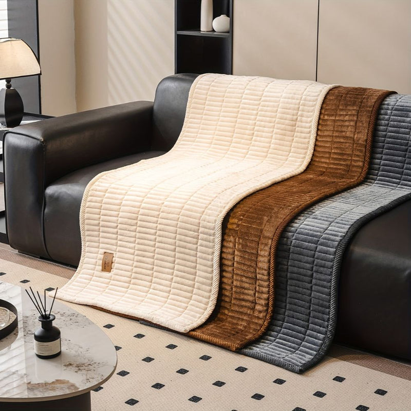 Sofa cover with quilted flannel effect design