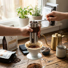Manual coffee grinder with adjustable settings and foldable handle