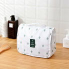 Toiletry bag with multiple compartments and hanging hook - white with cactus