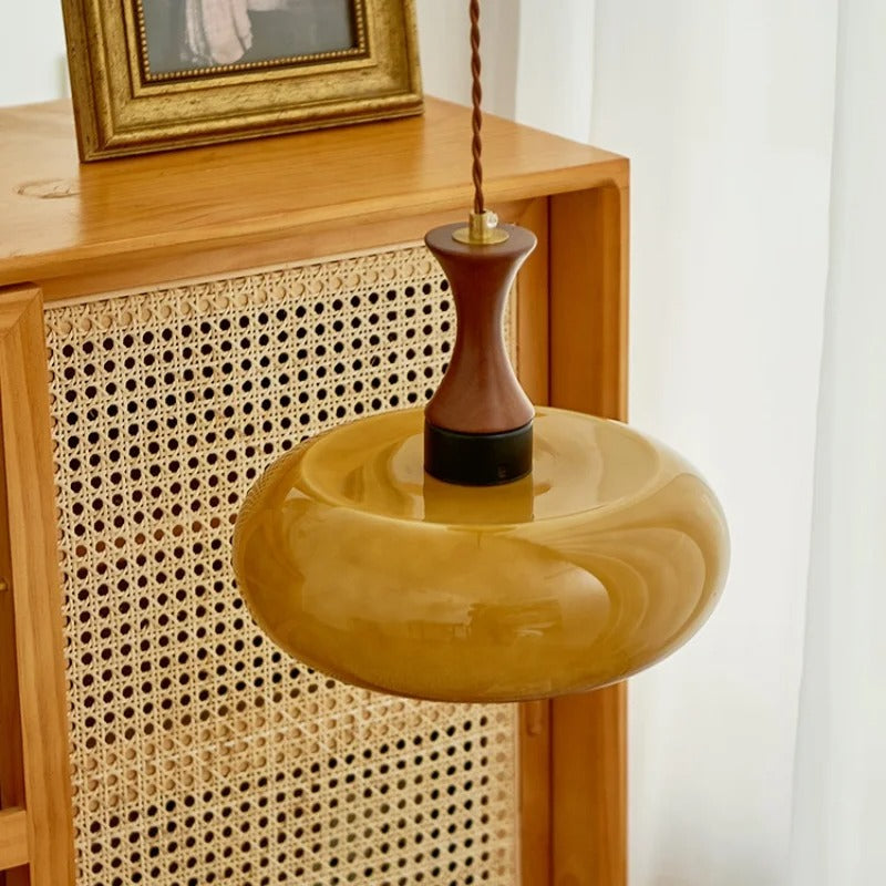Pendant light with adjustable cord and glass shade