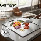 Cutting board with double sided titanium surface