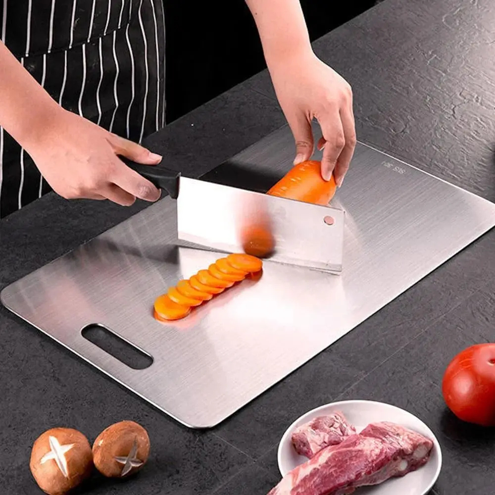 Cutting board with double sided titanium surface
