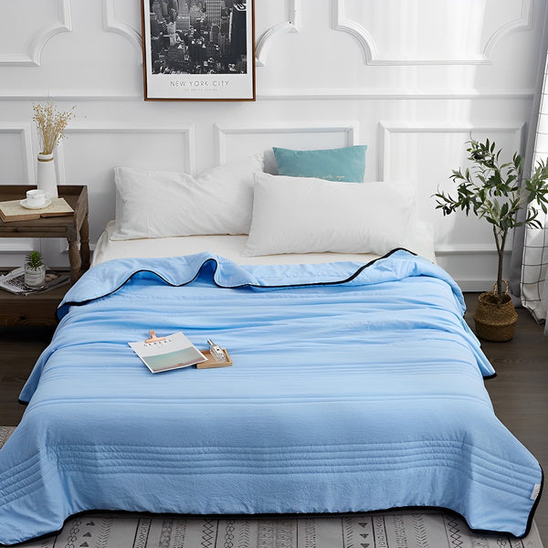 Cooling summer blanket with airy fabric construction - blue