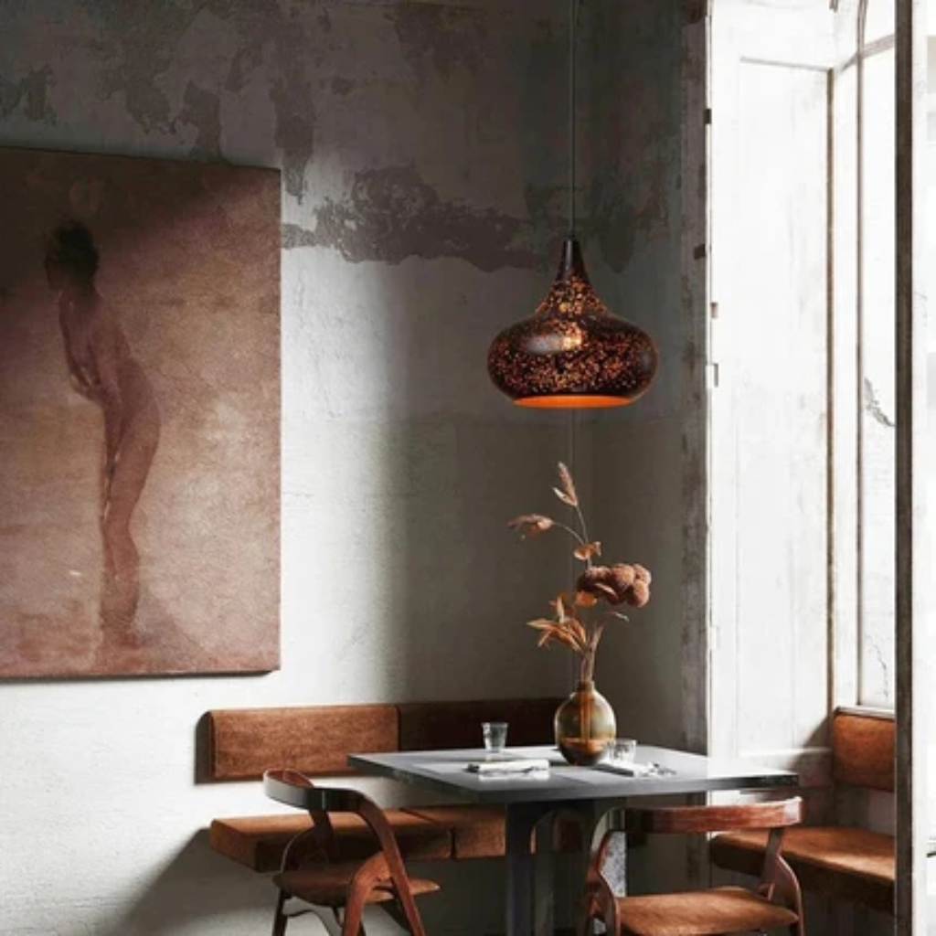 Pendant light fixture with perforated iron shade